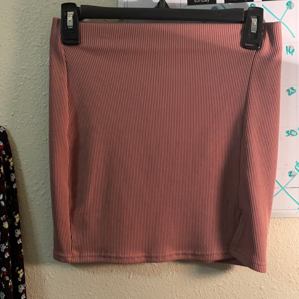 A mini skirt it’s a pastel pink it’s new never put it on and never will